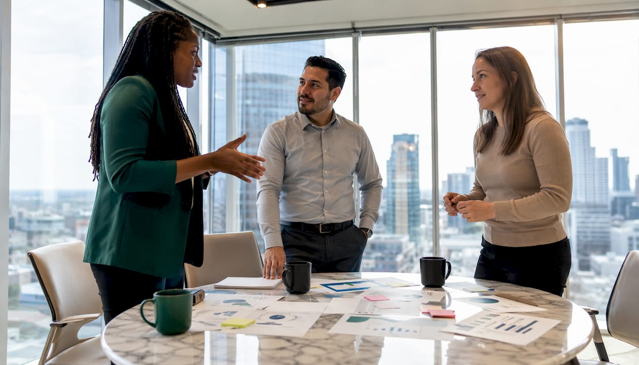 Consulting team discussing AI automation tools in meeting room